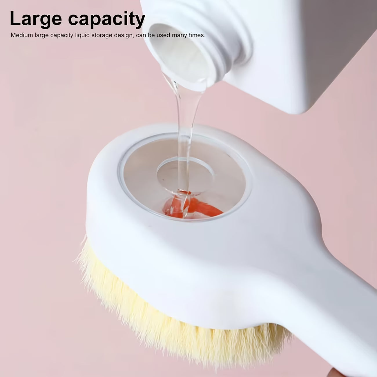 White cleaning brush with liquid being poured onto it against a pink background