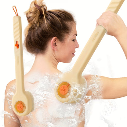 Woman using a back scrubber with orange bristles on a white background